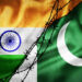 Grunge flags of India and Pakistan divided by barb wire illustration, concept of tense relations between India and Pakistan