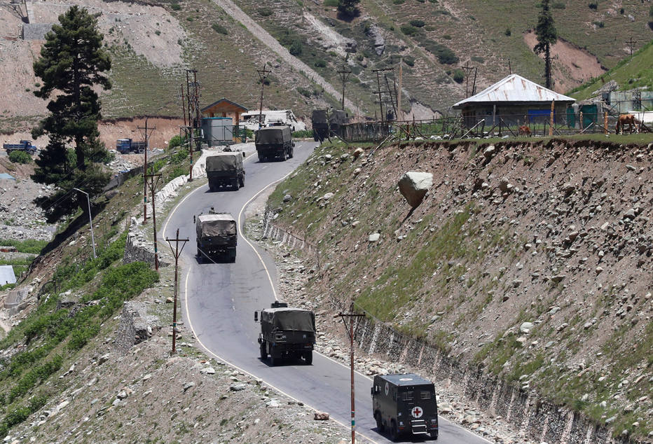 An Indian army convoy moves along Srinagar-Leh national highway, at Gagangeer, in east Kashmir's Ganderbal district, June 15, 2020. REUTERS/Danish Ismail