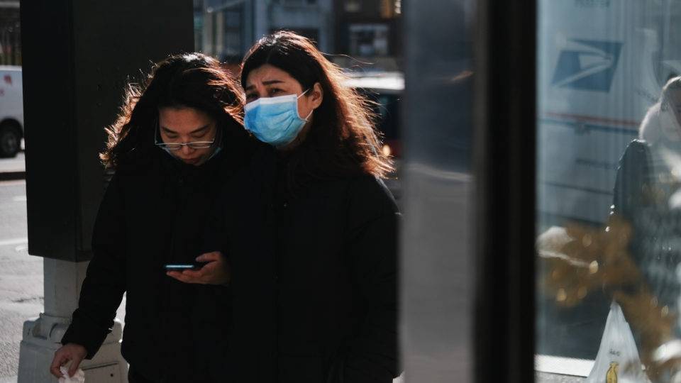 NEW YORK, NEW YORK - JANUARY 29: People wear medical face masks on the streets of Chinatown on January 29, 2020 in New York City. Sales of medical face masks have seen a sharp increase as fears of coronavirus grow and many retailers have sold out. The coronavirus, which originated in Wuhan, China, has now infected more than 6,150 people in more than a dozen countries.   Spencer Platt/Getty Images/AFP