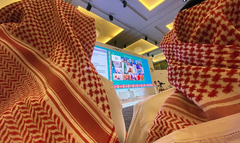 Journalists watch Saudi King Salman bin Abdulaziz's virtual speech live at the media centre during an opening session of the 15th annual G20 Leaders' Summit in Riyadh, Saudi Arabia November 21, 2020. REUTERS/Nael Shyoukhi