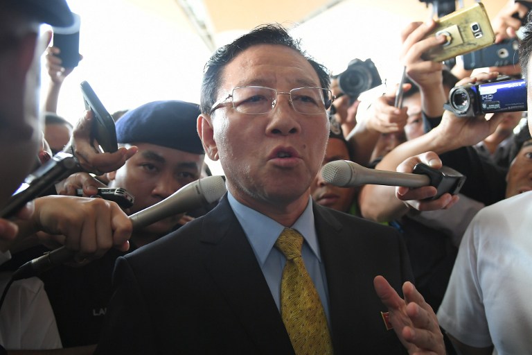 Expelled North Korean ambassador to Malaysia Kang Chol speaks to journalists outside the departure hall of the Kuala Lumpur International Airport in Sepang on March 6, 2017. 
North Korea's ambassador was escorted by a motorcade of armed police to the Kuala Lumpur airport on March 6 after being expelled in a deepening diplomatic dispute over the assassination of the half brother of Pyongyang's leader. / AFP PHOTO / MOHD RASFAN