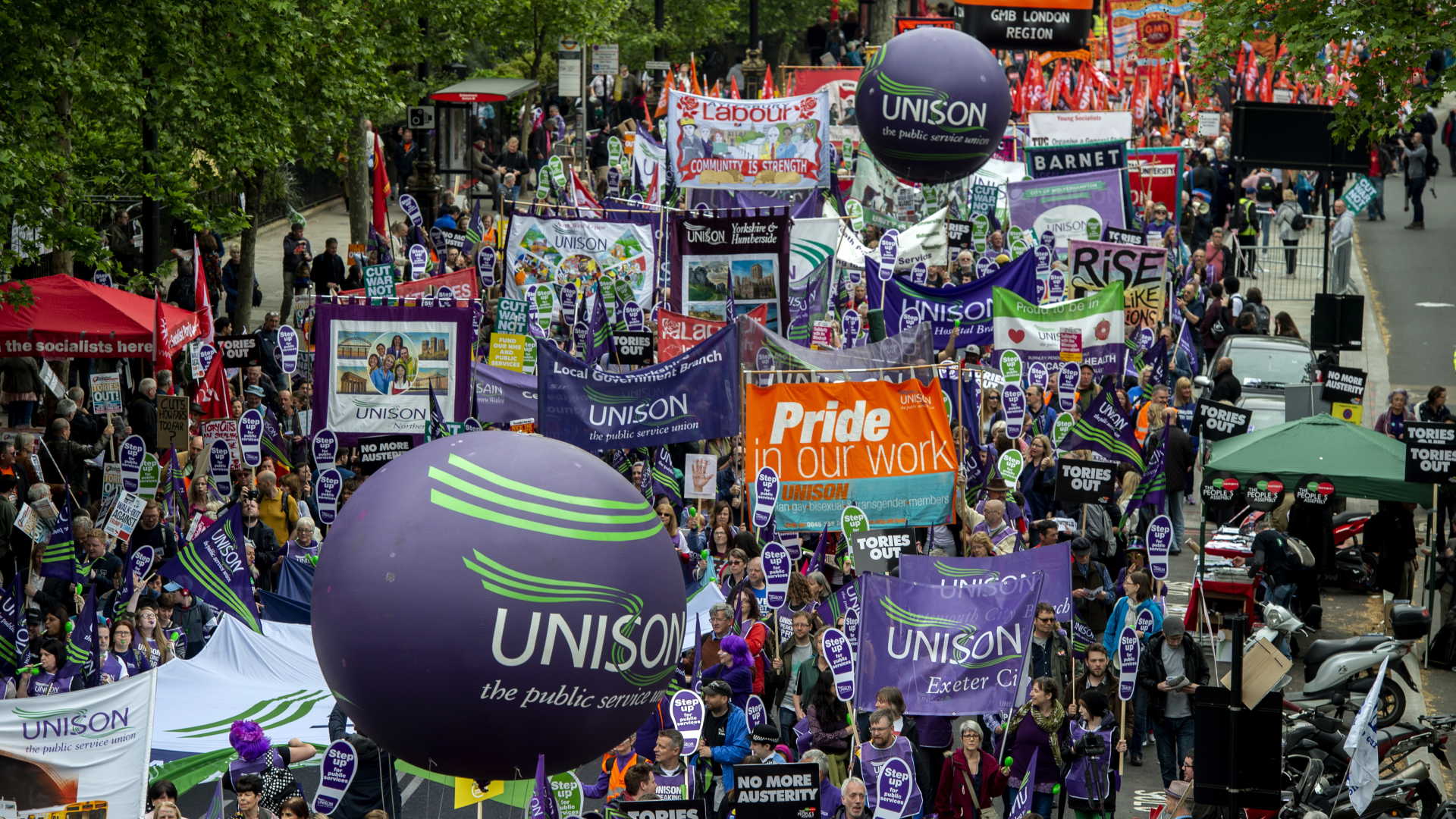 epa06730213 Demonstrators take part in the 'A New Deal for Working People' march organised by the Trade Union Congress (TUC) in central London, Britain, 12 May 2018. The mass demonstration was organised by the Trade Union Congress, to call for better pay and working conditions for public and private sector workers.  EPA/WILL OLIVER