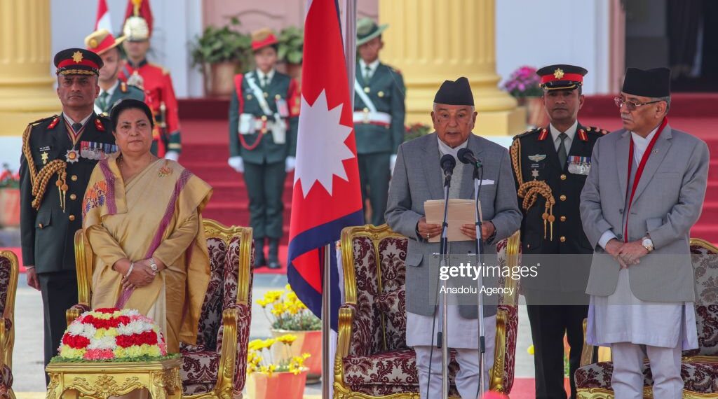 KATHMANDU, NEPAL- MARCH 13: Nepal's newly elected President Ram Chandra Poudel (C)  takes his oath of secrecy along with outgoing president Bidya devi Bhandari (L) and Prime Minister Puspa Kamal Dahal (R) in a ceremony at the Presidential residence in Kathmandu, Nepal on March 13, 2023. (Photo by Sunil Pradhan/Anadolu Agency via Getty Images)