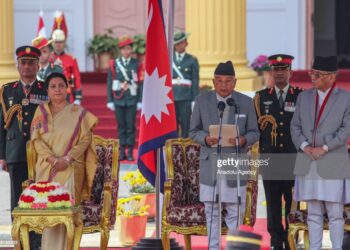 KATHMANDU, NEPAL- MARCH 13: Nepal's newly elected President Ram Chandra Poudel (C)  takes his oath of secrecy along with outgoing president Bidya devi Bhandari (L) and Prime Minister Puspa Kamal Dahal (R) in a ceremony at the Presidential residence in Kathmandu, Nepal on March 13, 2023. (Photo by Sunil Pradhan/Anadolu Agency via Getty Images)