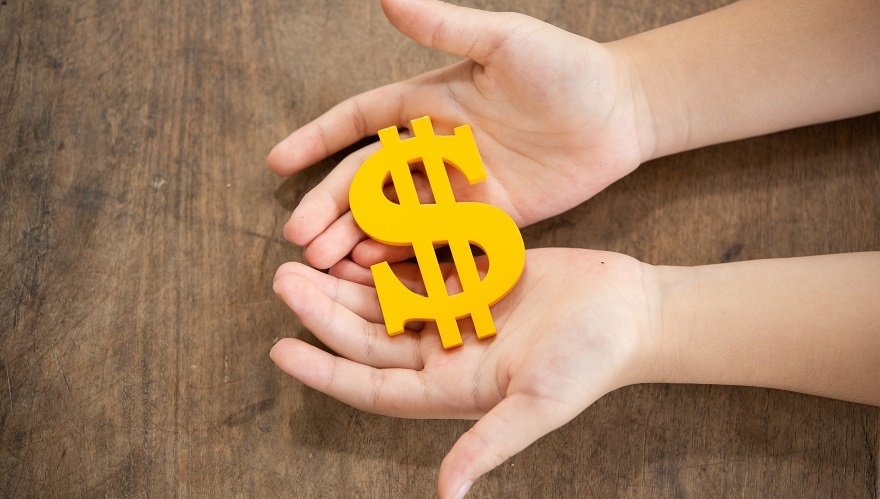 The yellow dollar symbol on hands child for the investment or saving of people with differences diversity for insurance, education, safety life for good and stable in future of family
