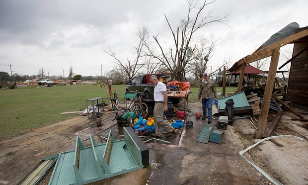 Glenn and Randy Bell salvage tools from their brother’s workshop after apparent tornadoes stuck the Maryville community near Thomasville, Georgia. Photograph: Mark Wallheiser/EPA